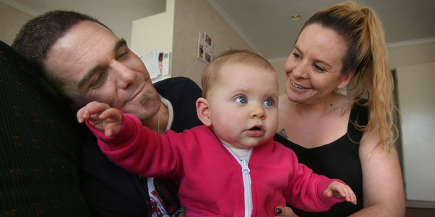 Evan Hutchinson, who had post-natal depression in 2010, and partner Nicole Hunt with seven-month-old baby, Laila.